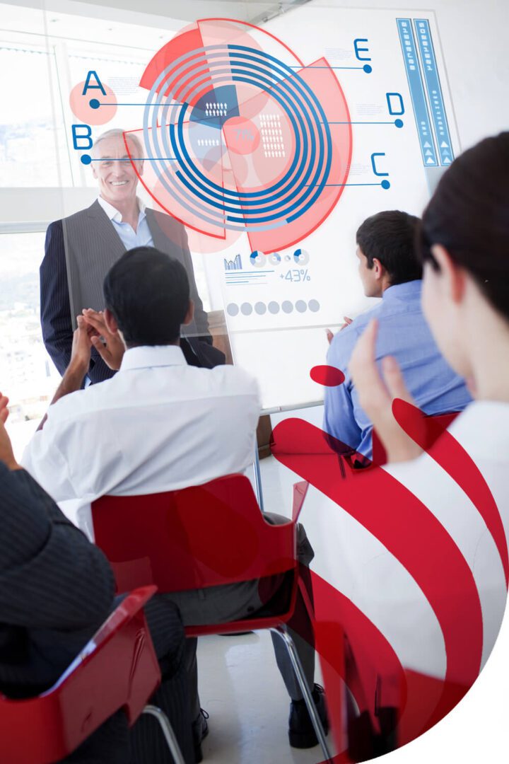Business team listening to a presentation in a modern office.