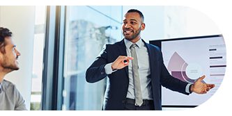 Confident businessman giving a presentation in a modern office.