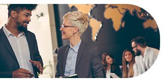 A professional woman smiling and looking sideways during a business event.