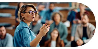 Teacher passionately explaining a topic to students in a classroom.