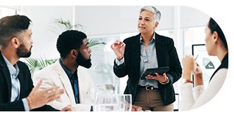 A woman explains a point to a man during a meeting.