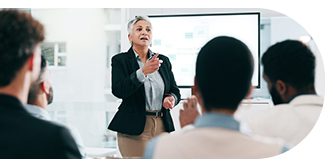 A professional woman giving a presentation to an audience.