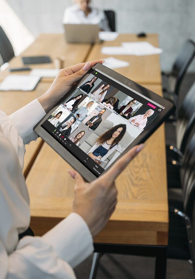 Tablet displaying a video conference meeting.