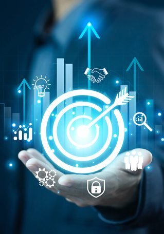 Businessman holding a holographic target with growth and technology icons.