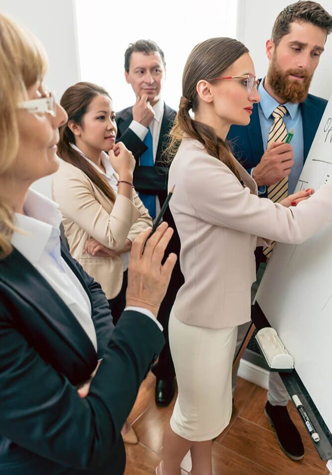 Business team applauding a presentation in a meeting room.