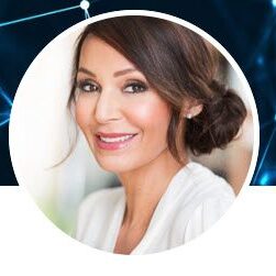 Professional headshot of a smiling woman with neat hair and makeup.